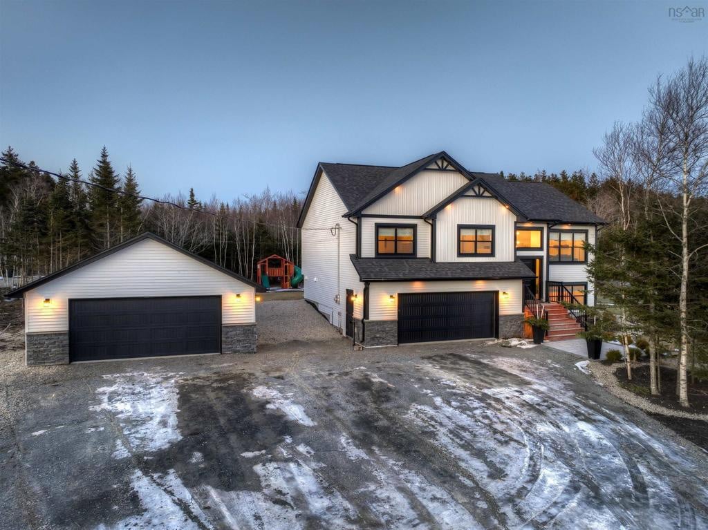 A custom built 16x7 garage with double door, a man door and a window. 